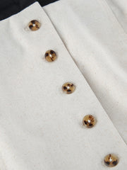 Beige cotton blend button front maxi dress detail with tortoise shell buttons