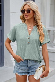 Light green textured henley tee with rolled sleeves and button detail