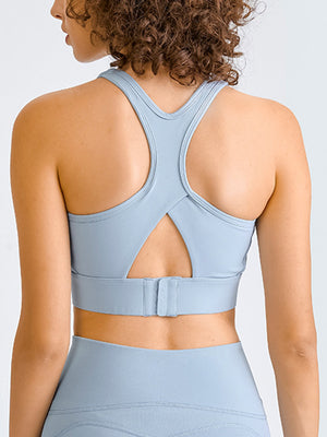 Light blue racerback crop top with cutout detail and adjustable band