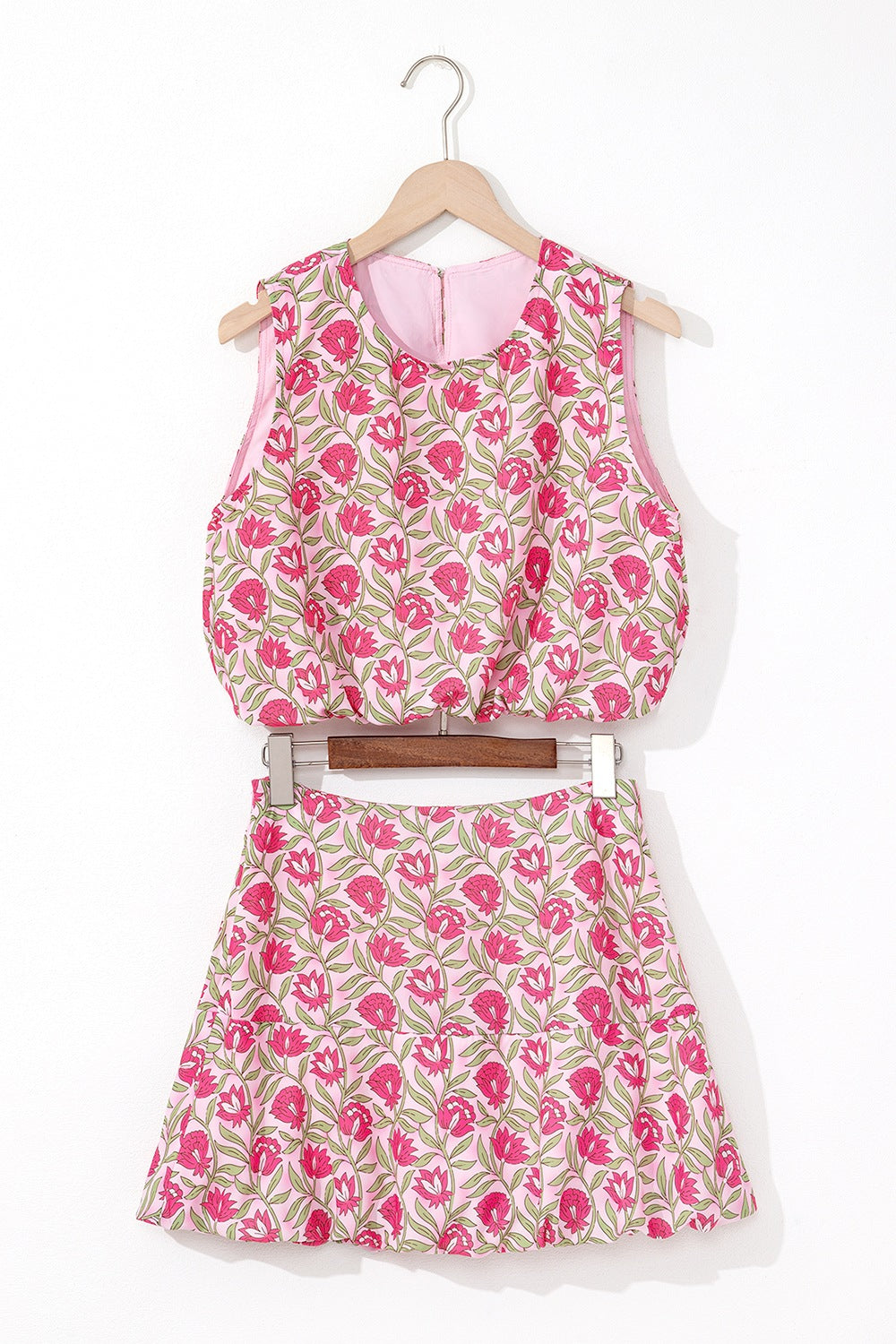 Floral print crop top and A-line skirt set in dusty pink with pink blooms and green leaves.