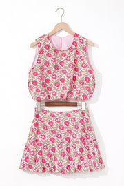 Floral print crop top and A-line skirt set in dusty pink with pink blooms and green leaves.
