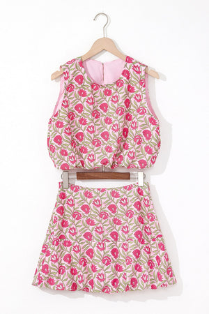 Floral print crop top and A-line skirt set in dusty pink with pink blooms and green leaves.