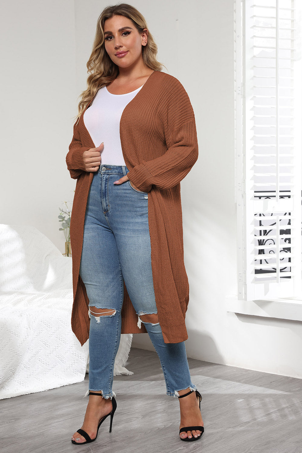 Oversized knit maxi cardigan in caramel with open front and long sleeves.