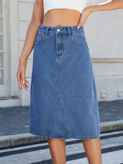 Light blue denim midi skirt with panel seams and a raw hem