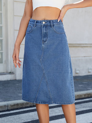 Light blue denim midi skirt with panel seams and a raw hem