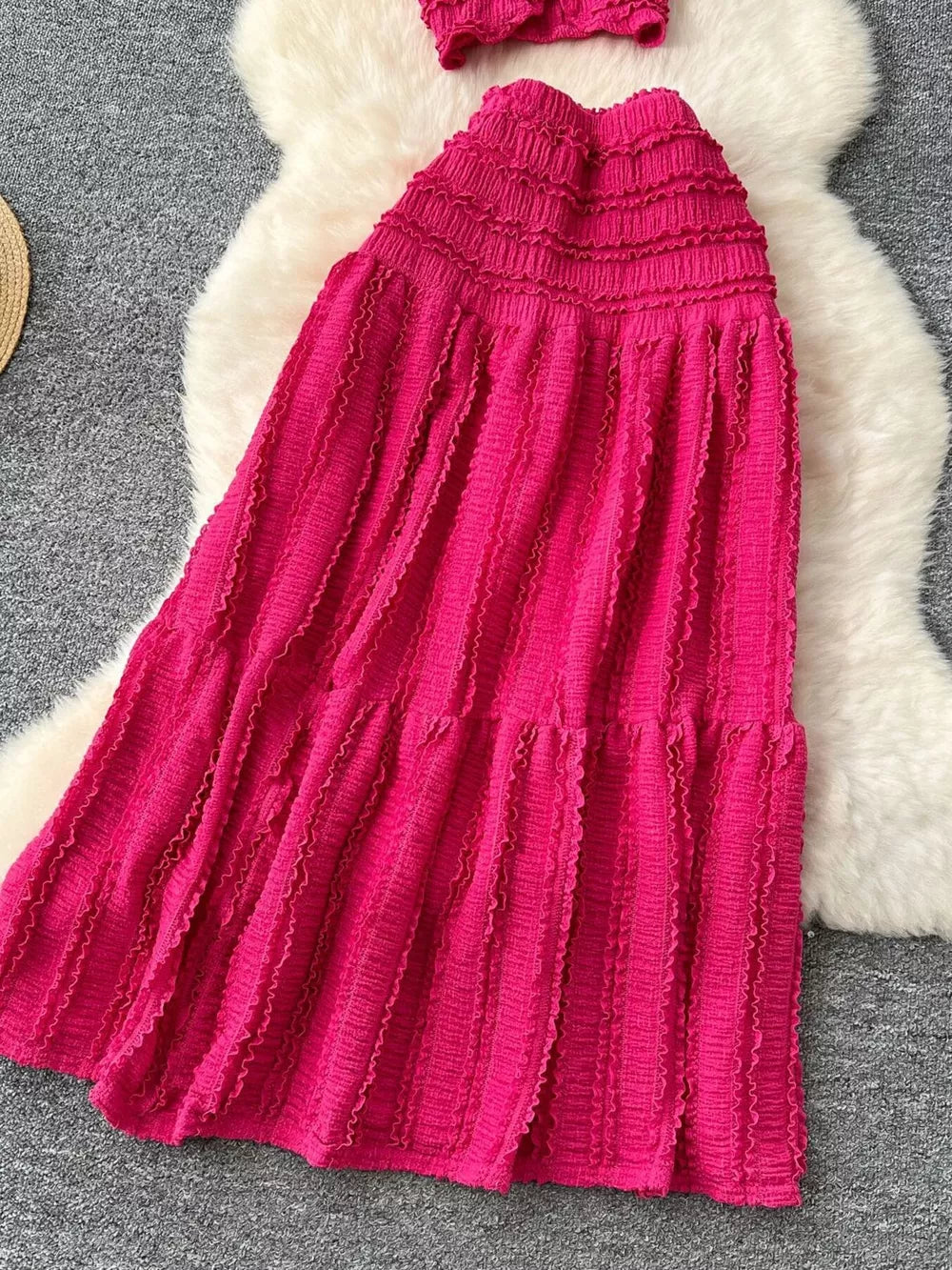 Textured rose red two-piece set with ruffled details and smocked bodice.