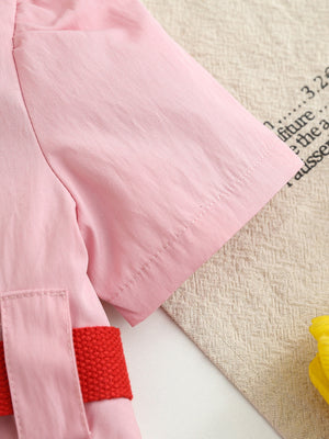 Pink cotton blend baseball dress for kids with red adjustable belt detail.
