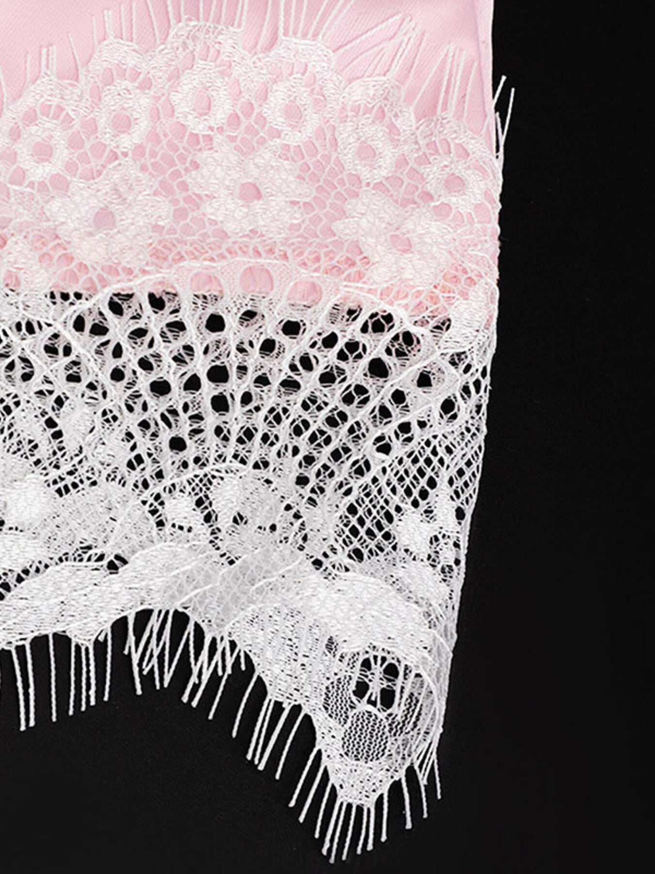 Pink satin camisole with delicate white lace trim and asymmetrical hem.