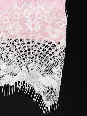 Pink satin camisole with delicate white lace trim and asymmetrical hem.