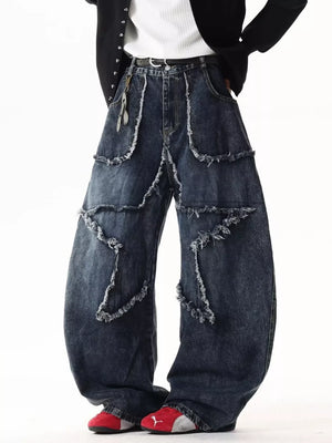 Dark wash wide leg jeans with star patchwork and distressed frayed details.