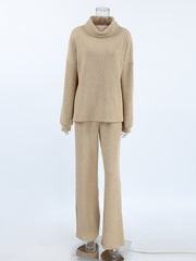 Beige cowl-neck turtleneck sweater and wide-leg pants set with ribbed texture.