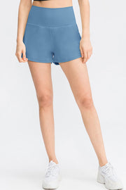 Sculpted high-waist active shorts in Light Blue with a V-cut hem.