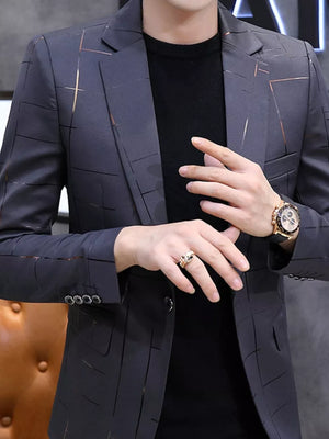 Men's grey slim fit blazer with subtle gold and black grid pattern, single button closure.