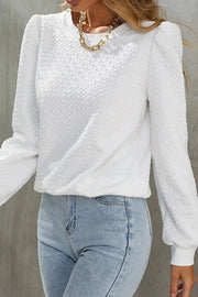 White textured puff sleeve crewneck pullover sweater with a diamond pattern.
