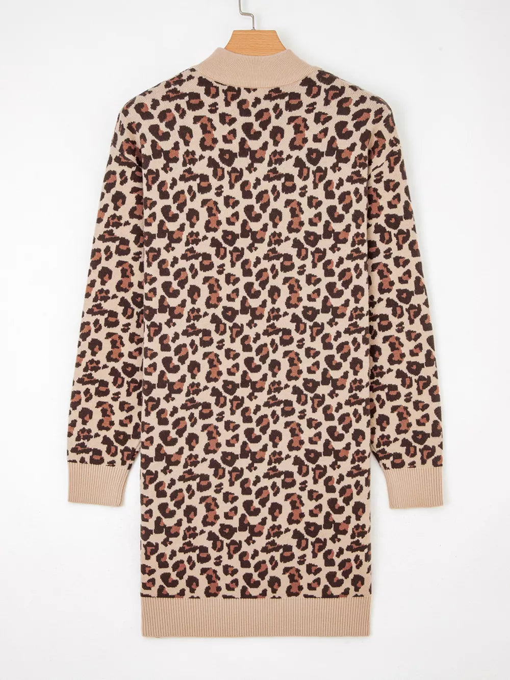 Leopard print ribbed high neck sweater dress with long sleeves and a beige knit trim.
