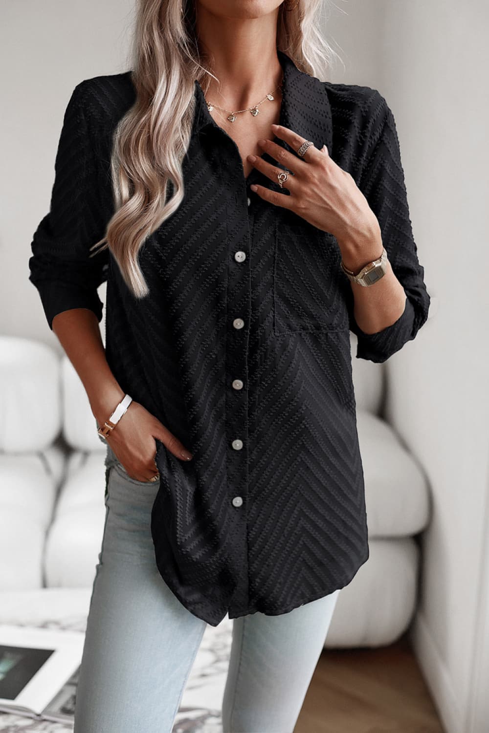 Black textured chevron button-down blouse with a collared neckline and chest pocket.