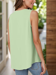 Sleeveless light green blouse with pleated front detail.