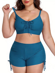 Plus size Peacock Blue adjustable swimwear set with drawstring tie-front top and ruched shorts.