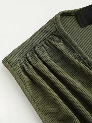 Textured ribbed army green plunge romper with ruched detail.