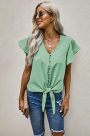 Button-down ruffle sleeve tie-front top in Gum Leaf green with V-neck and button closure.