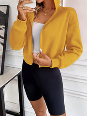Cropped hooded zip-up sweatshirt in mustard yellow with a relaxed fit and ribbed cuffs.