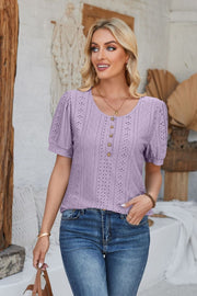 Lavender perforated puff sleeve henley blouse with button detail and eyelet pattern.