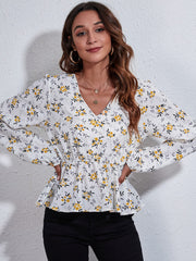 White floral peplum blouse with gathered waist and V-neck