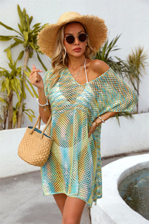 Open-knit caftan with V-neck and short sleeves in a colorful tie-dye pattern.