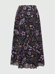 Black midi skirt with a whimsical floral and butterfly print.