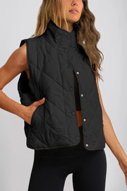 Black quilted stand collar vest with snap front and pockets