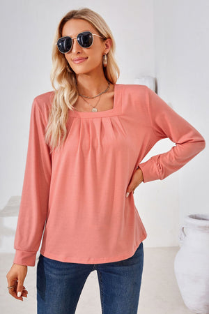 Burnt Coral jersey top with gathered square neckline and long sleeves.