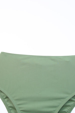 Sage ruched bodice halter swim dress detail showing high waist and stitching