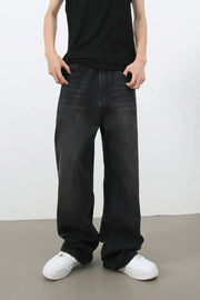 Black wide leg denim jeans with a relaxed fit and faded wash.