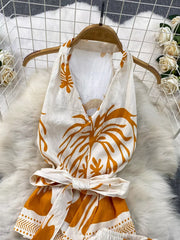 Tropical print halter top and shorts set with belted detail in yellow and white polyester.