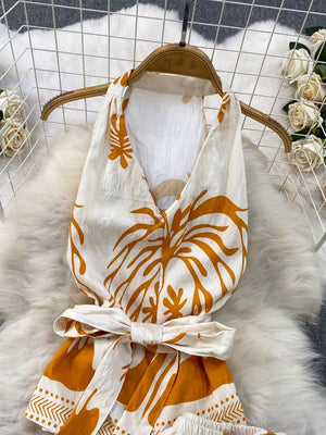 Tropical print halter top and shorts set with belted detail in yellow and white polyester.