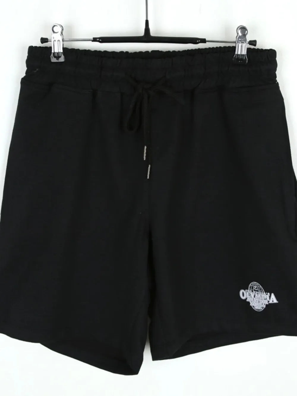 Black jersey shorts with drawstring waist and Olympia logo detail.