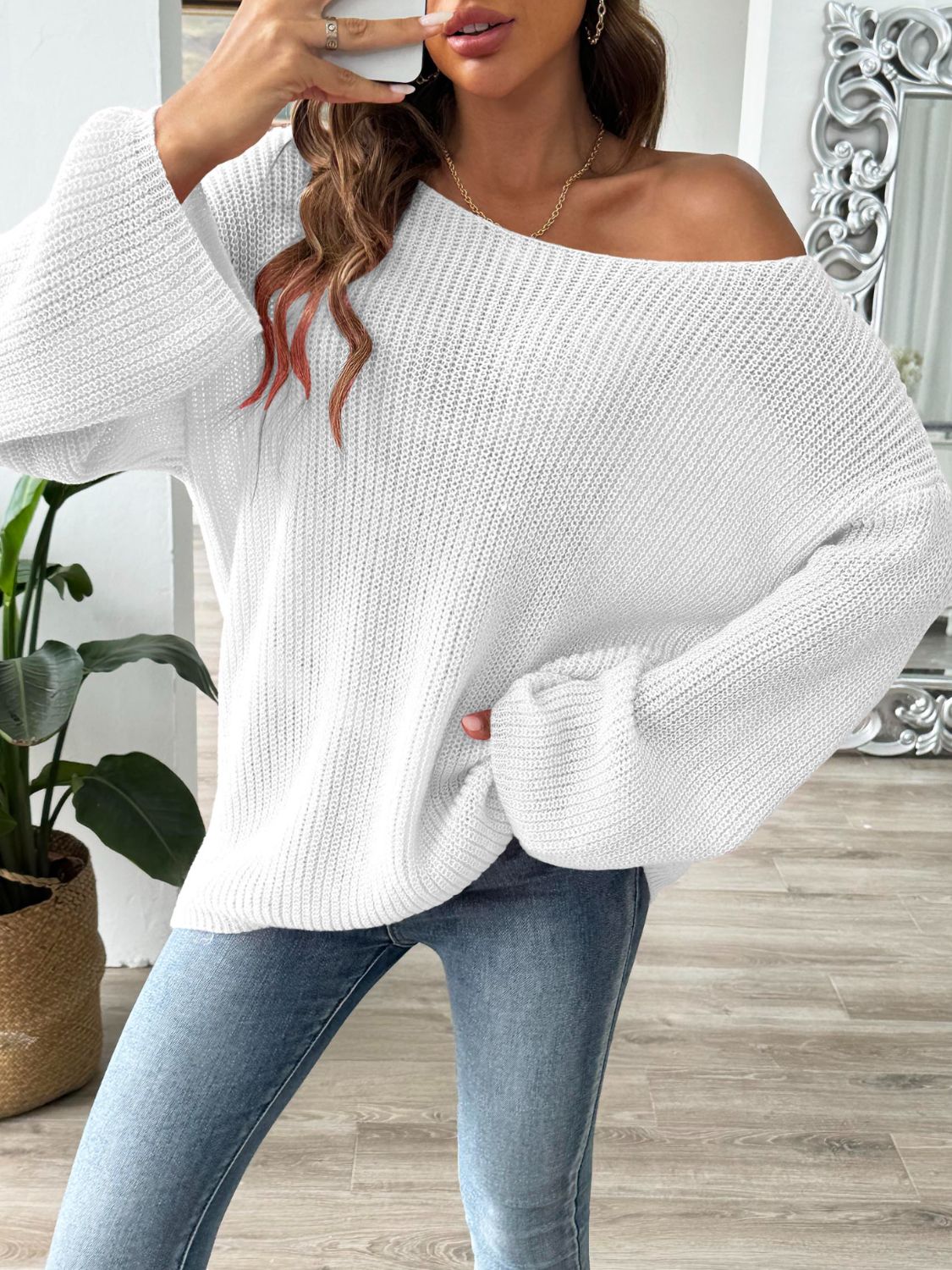 White off-the-shoulder ribbed knit pullover sweater with bell sleeves.