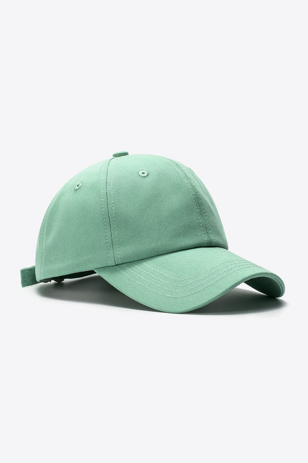 Green cotton baseball cap with adjustable strap and stitched details