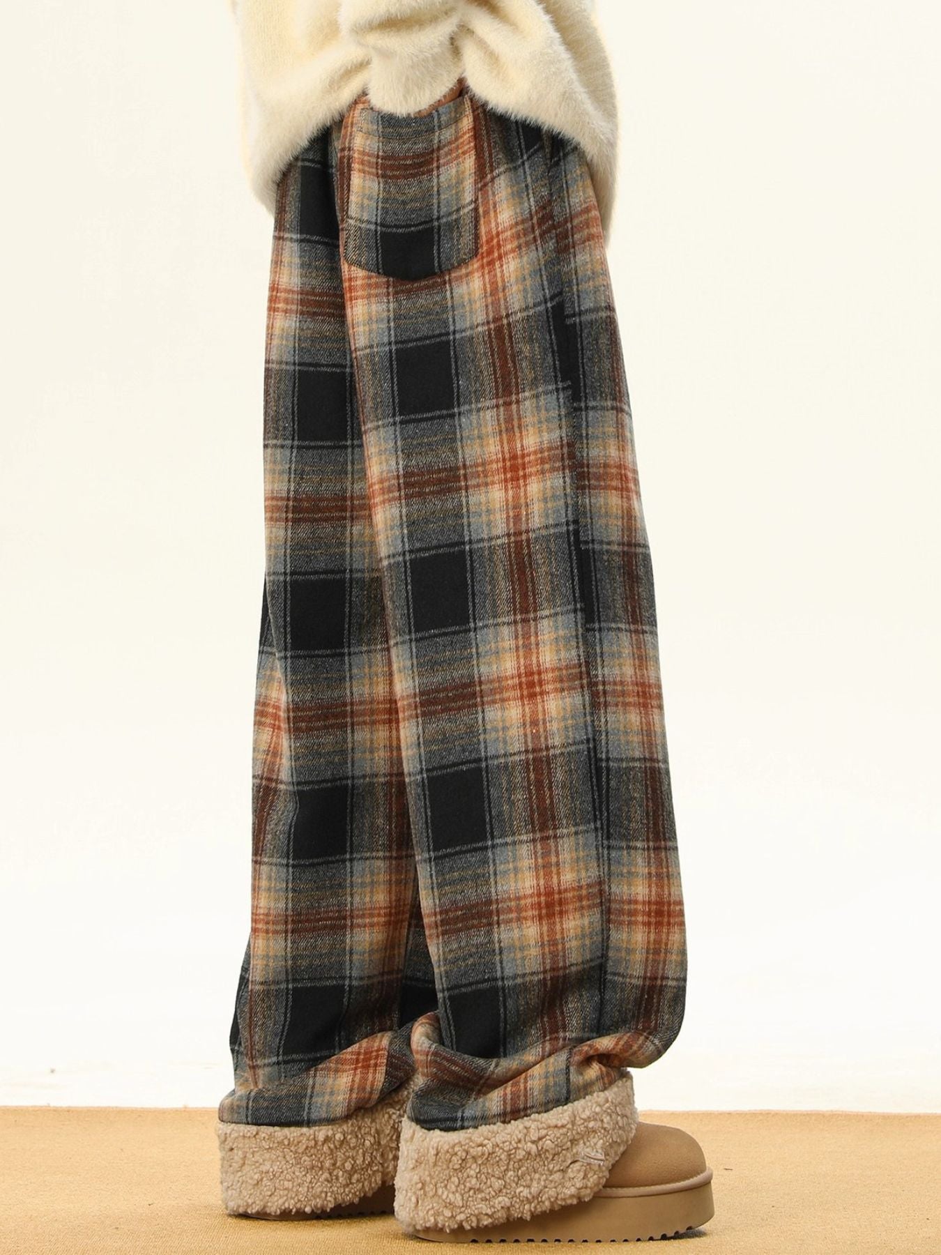 Men's plus-size plaid sweatpants in brown and black with a relaxed fit and elastic waist.