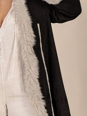 Black hooded duster coat with faux shearling trim and contrast stitching detail.