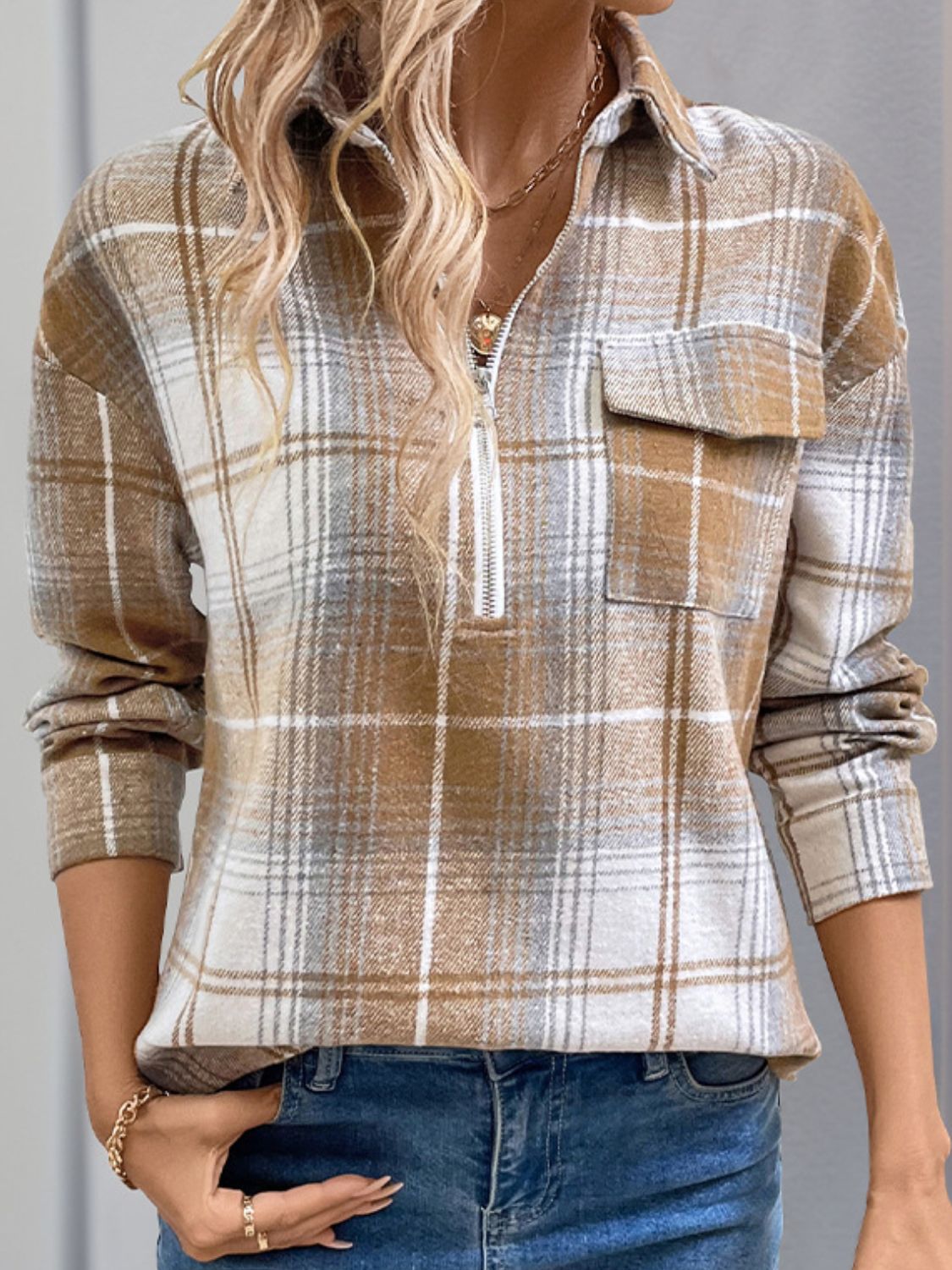 Plaid zip-through shirt in camel with a chest pocket and collared neckline.