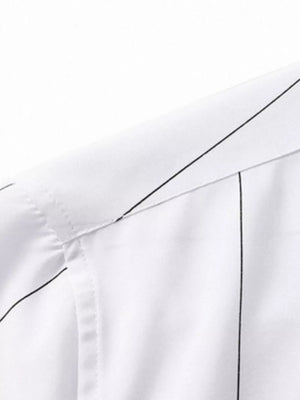 White cotton oversized pinstripe button-down shirt detail showing collar and stitching.