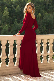 Red long sleeve maxi dress with sculpted bodice and fishtail hem.