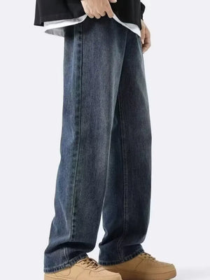 Classic vintage loose-fit men's dark wash denim jeans with a relaxed cut.