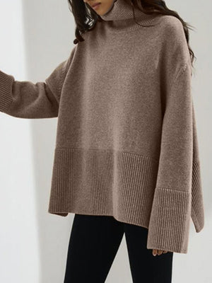 Mocha ribbed turtleneck sweater with flared sleeves and ribbed hem detail.