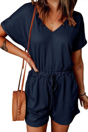 Dark blue ribbed V-neck romper with drawstring waist and short sleeves