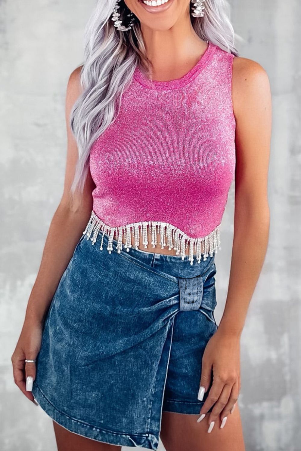 Denim wrap skort in medium wash with a knot and buckle detail.