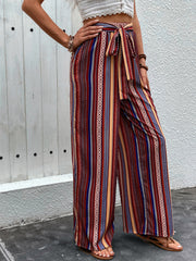 Bohemian stripe palazzo trousers in rust with tie-waist and wide leg