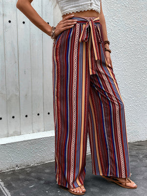 Bohemian stripe palazzo trousers in rust with tie-waist and wide leg
