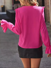 Hot Pink blouse with cascading ruffle sleeves and button front detail.